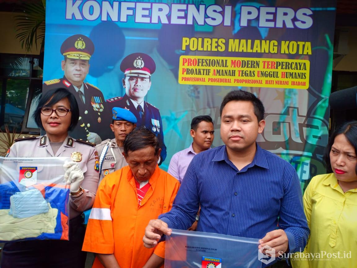 Kasat Reskrim Polres Malang Kota, AKP Komang Yogi Arya Wiguna saat merilis teraangka pencabulan.