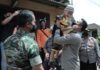 Kapolresta Malang Kota, Kombes Pol Budi Hermanto menggendong Agung, anak yang sejak lahir penyandang Disabilitas (ist)