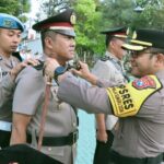 Foto : Kapolres Batu saat pimpin Sertijab Kapolsek Pujon di Lapangan Apel Mapolres Batu.(Ist)