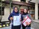 Maya Tri Utami (kiri), usai melaporkan Bos Koperasi atas dugaan penggelapan serifikat rumah di Polresta Malang Kota, Jumat (09/05/2025).